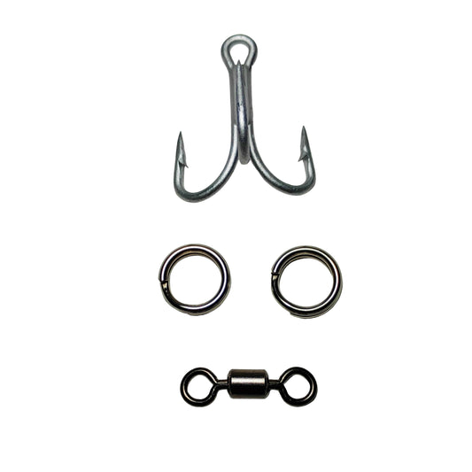 Fishing hooks, rings, and a swivel on a light gray background